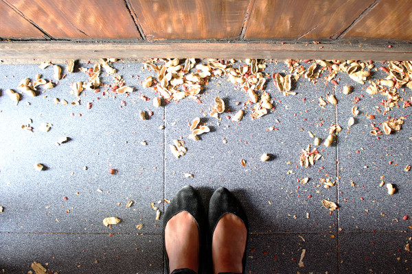 Peanut shells on floor at Taberna do Poncha