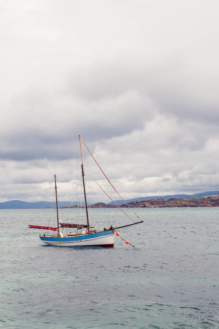 A boat anchoring in the harbour of Iona in Scotland.